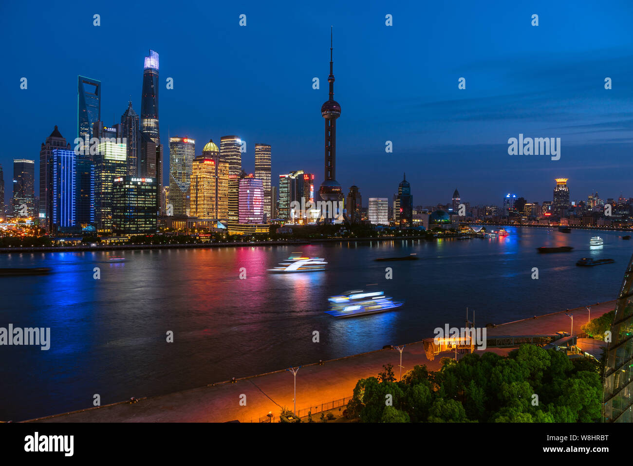 Night view of Huangpu River and the Lujiazui Financial District with the Oriental Pearl TV Tower, tallest, the Shanghai World Financial Center, thrid Stock Photo