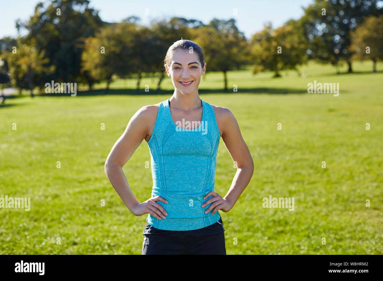 Young woman resting, hands on hip. Stock Photo