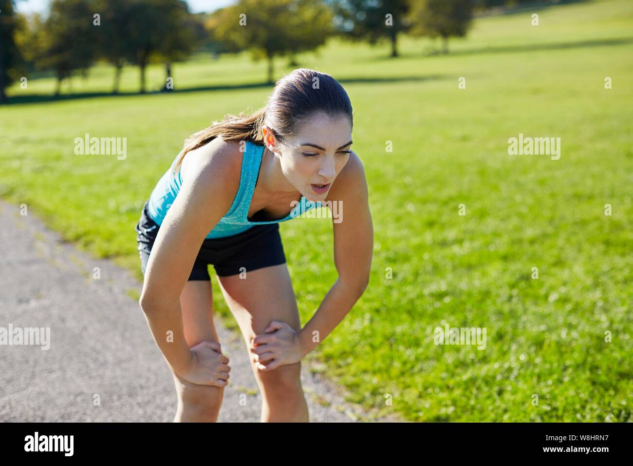 Woman recovering after exercise. Stock Photo