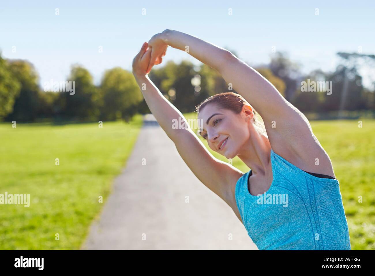 Young woman stretching. Stock Photo