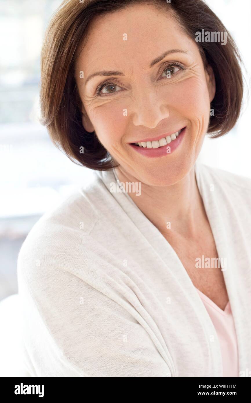 Senior woman smiling towards camera. Stock Photo