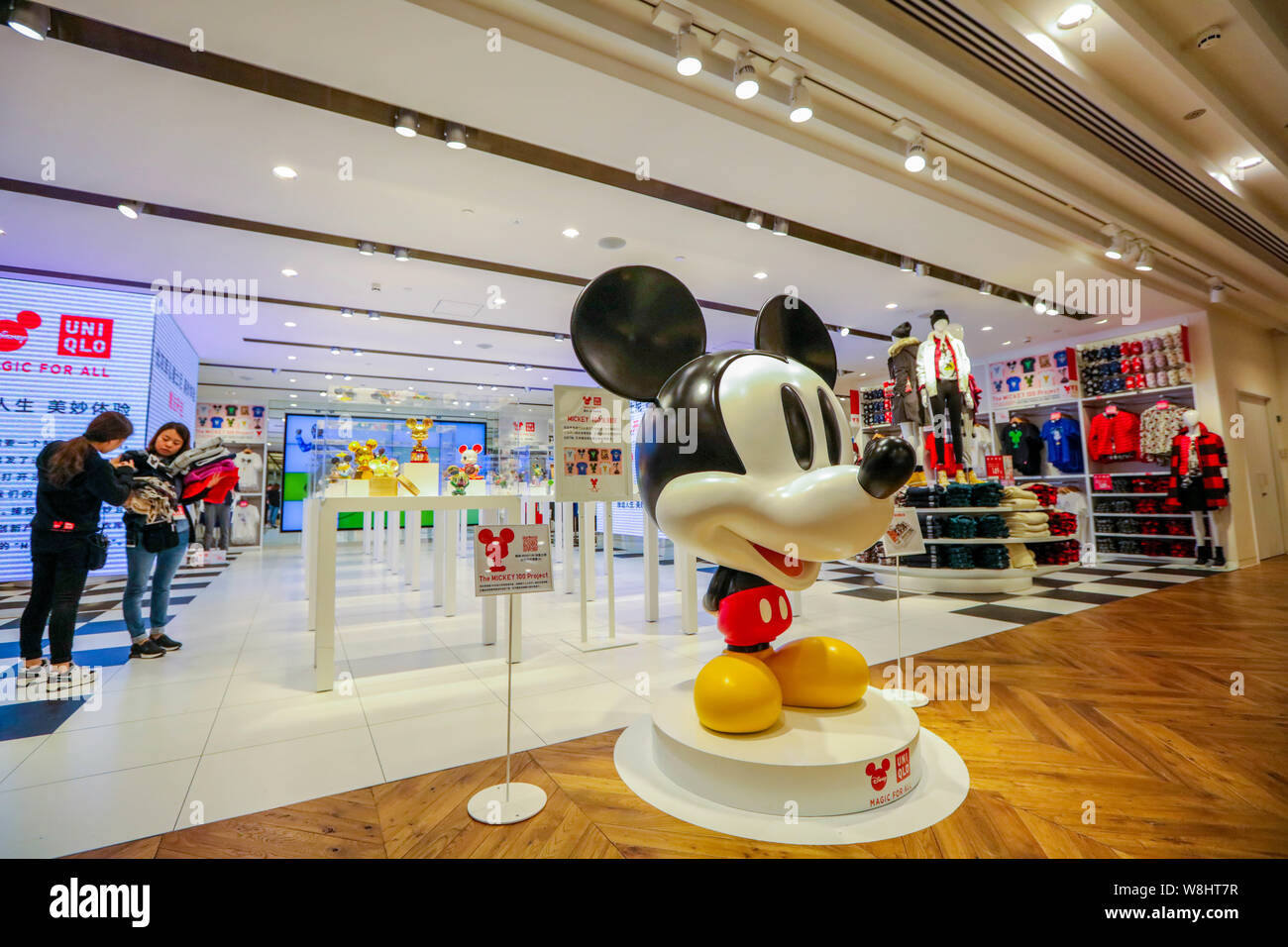 A Mickey Mouse statue is pictured at the Uniqlo's Disney-inspired concept  store in Shanghai, China, 29 September 2015. Uniqlo, the popular Japanese  Stock Photo - Alamy
