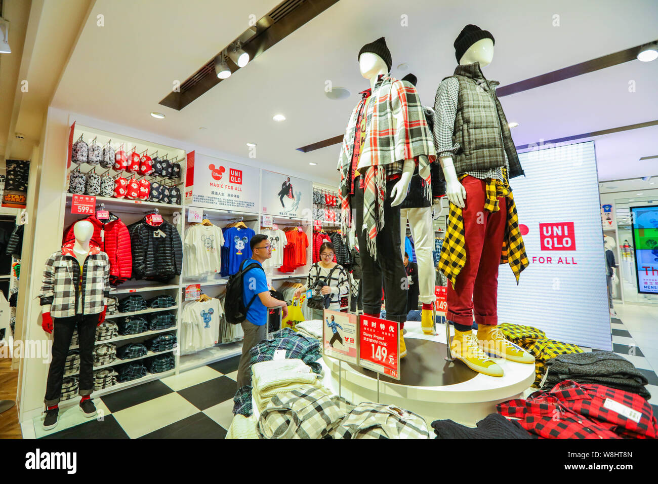Customers Shop For T Shirts And Jackets Of Magic For All Series At The Uniqlo S Disney Inspired Concept Store In Shanghai China 29 September 15 Stock Photo Alamy