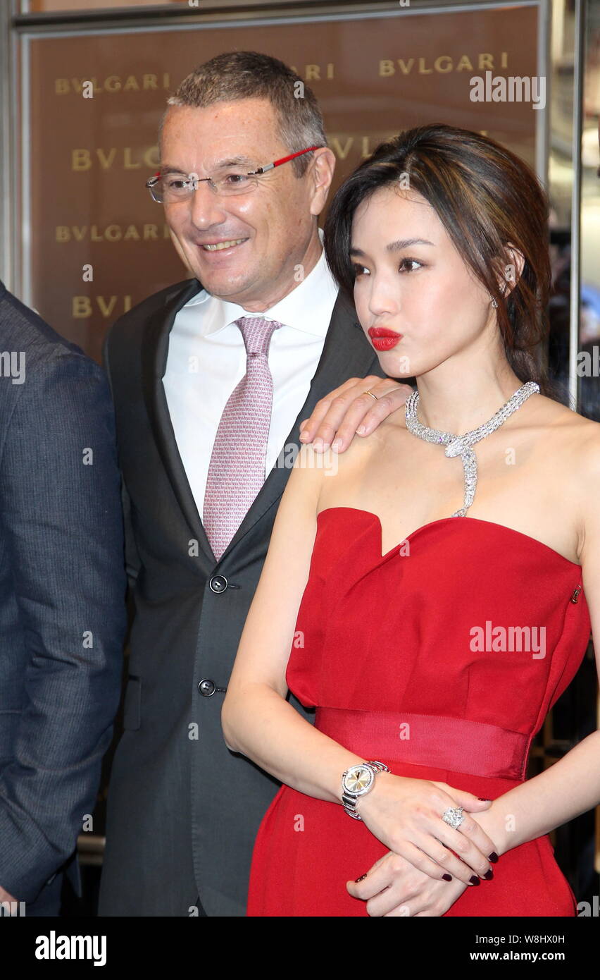 Taiwanese actress Shu Qi right poses with Bulgari CEO Jean Christophe Babin left at the opening ceremony for Bulgari s flagship store in Hong Kong Stock Photo Alamy