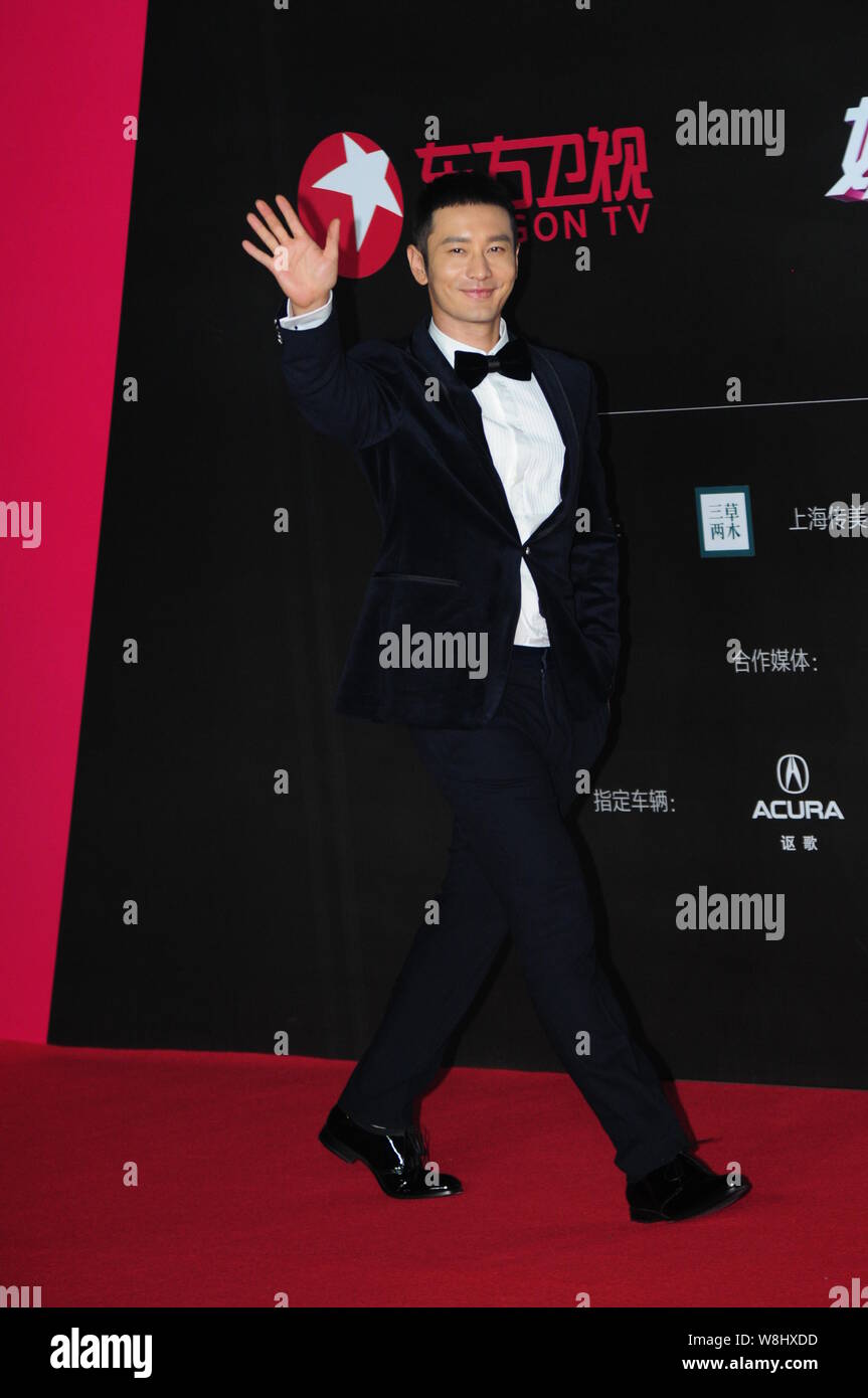 Chinese actor Huang Xiaoming waves on the red carpet for a gala of the Dragon TV in Shanghai, China, 14 November 2015. Stock Photo