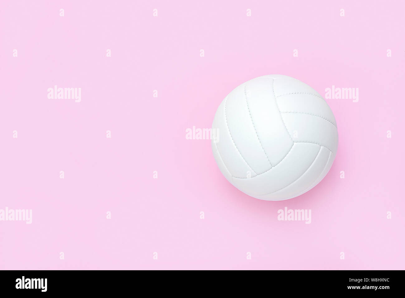 White volleyball leather ball on pink background. Top view Stock ...