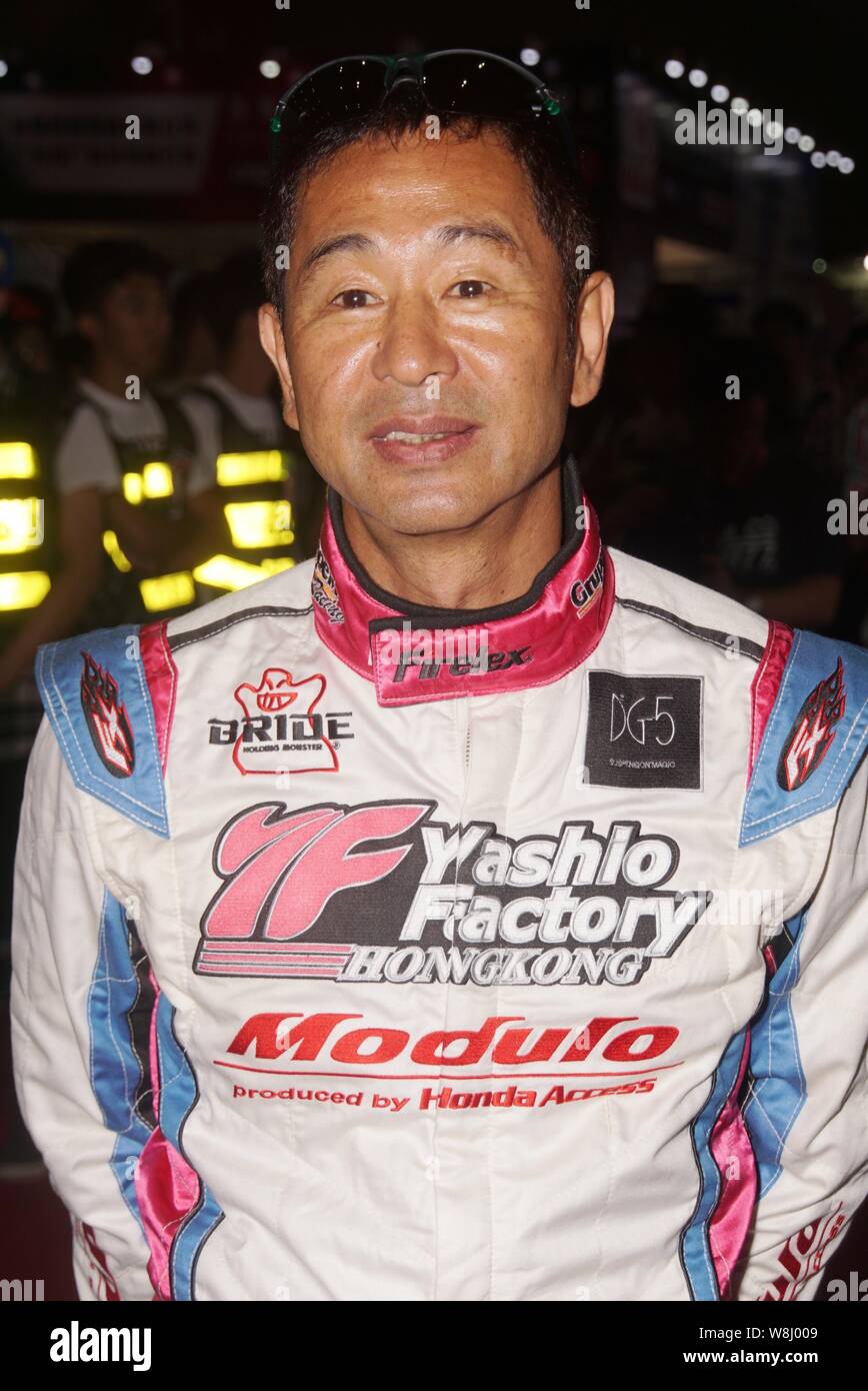 Japanese race car driver Keiichi Tsuchiya poses during a fan meeting
