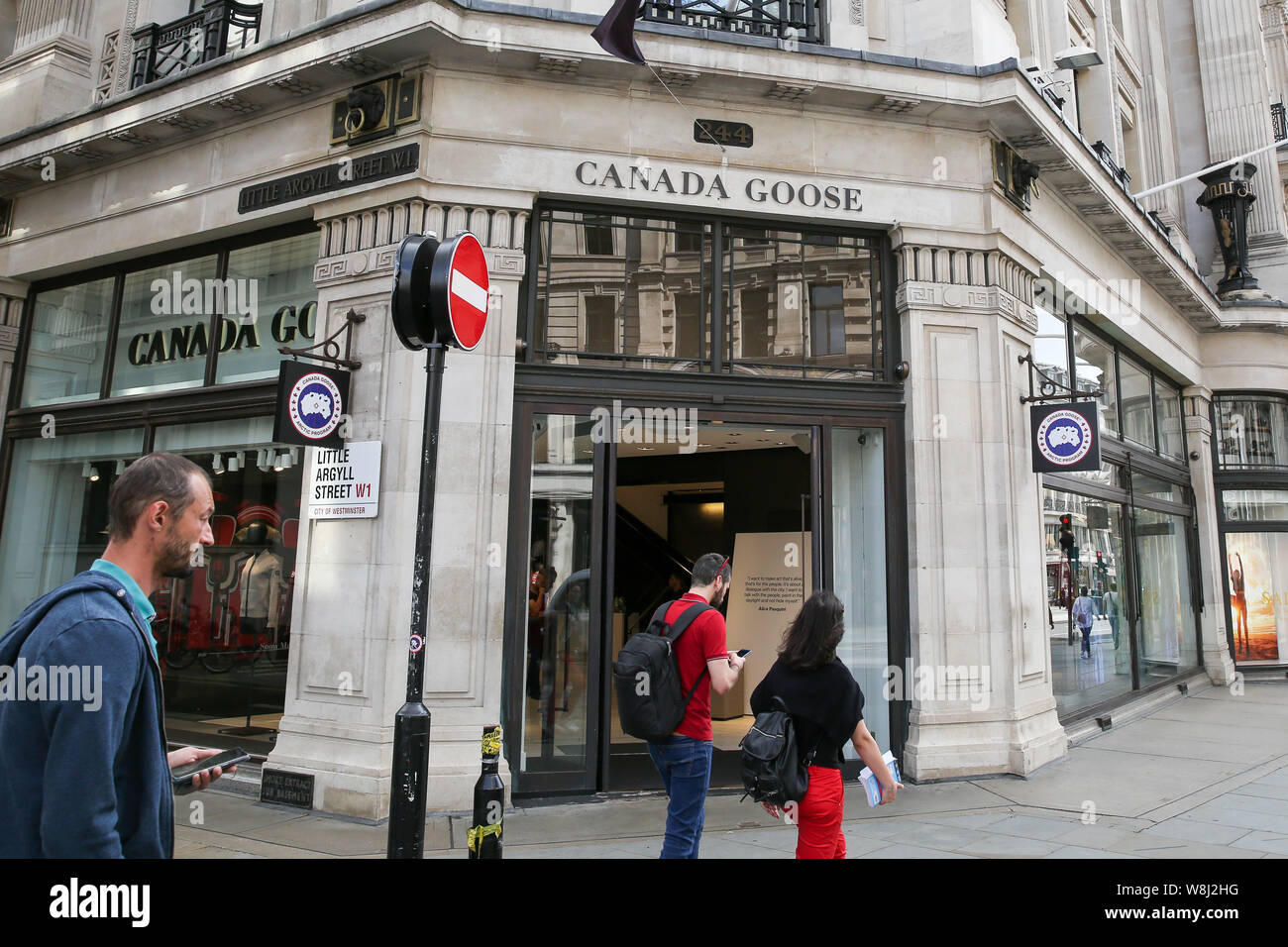Shoppers walk past a Canada Goose store in central London Stock Photo -  Alamy