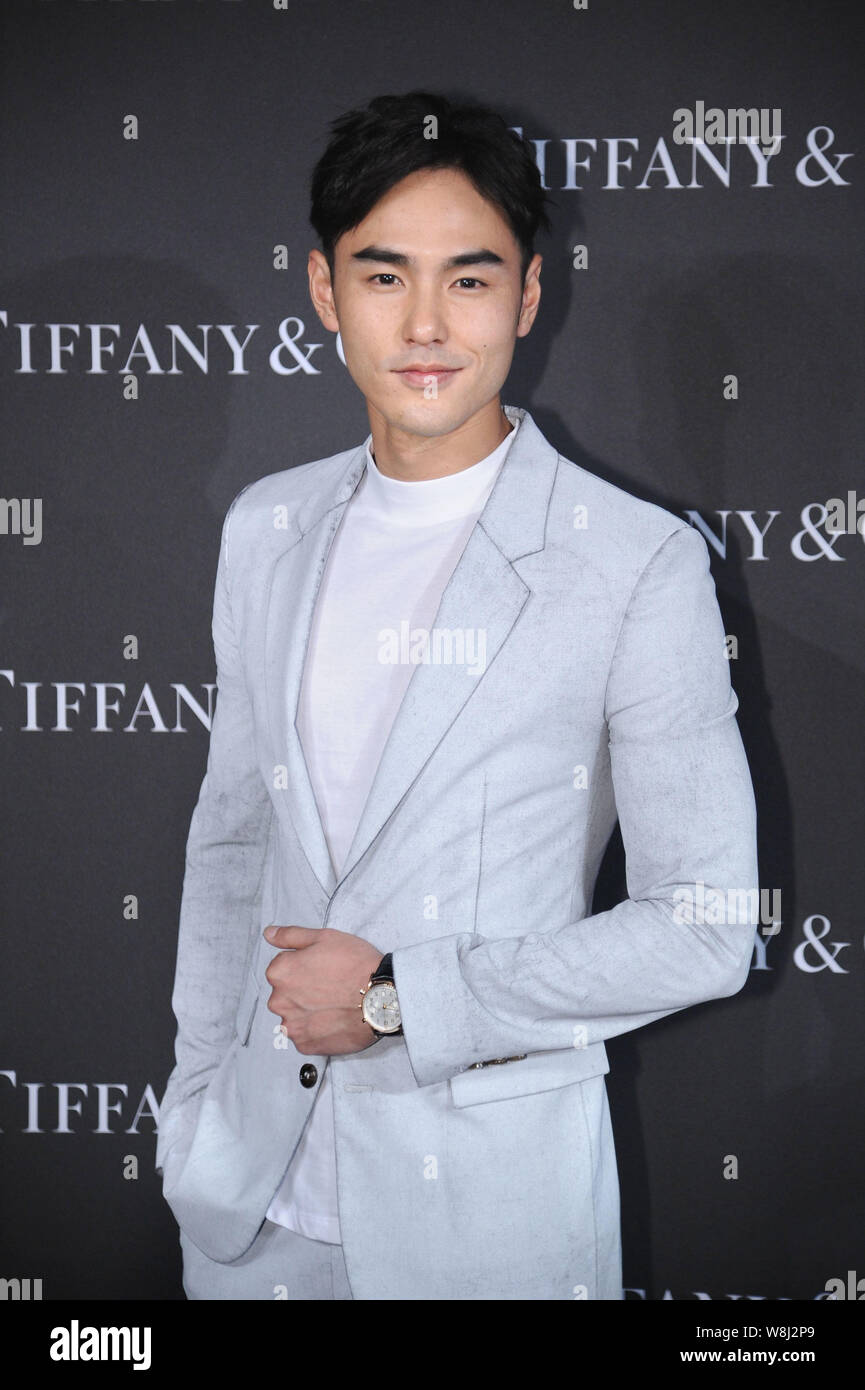 Taiwanese actor Ethan Juan poses as he arrives for a new products