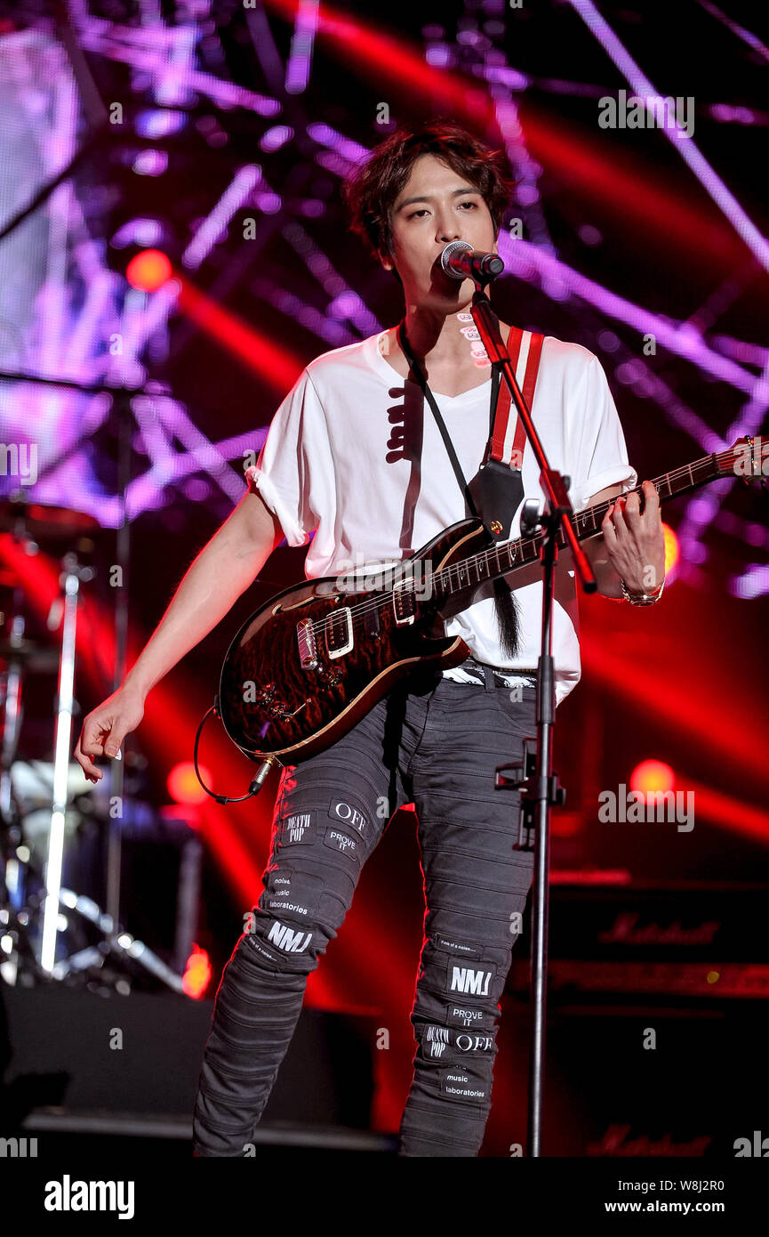 Singer Jung Yong-hwa of South Korean boy group CNBlue performs at the FNC Kingdom concert in Hong Kong, China, 16 May 2015. Stock Photo