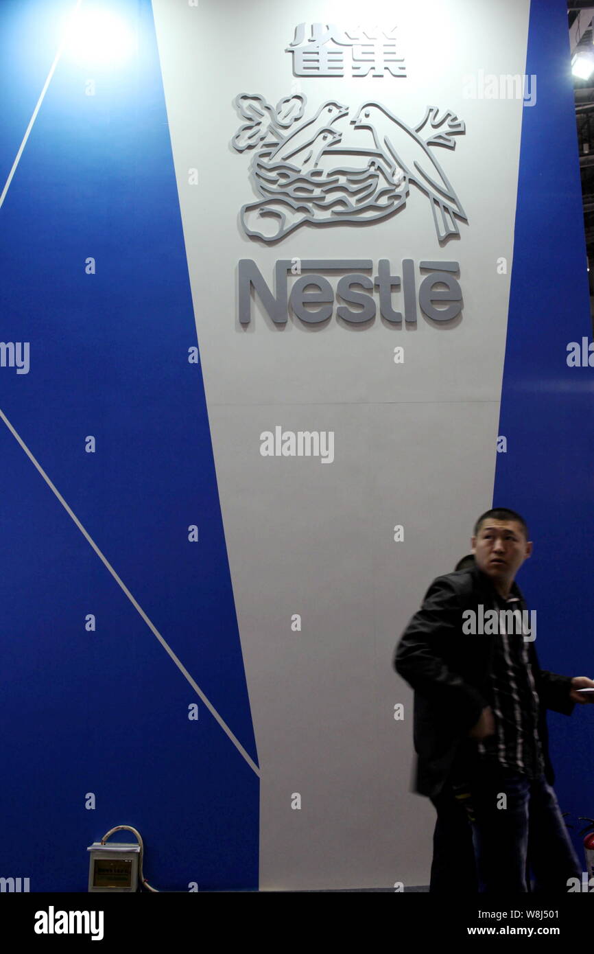--FILE--A visitor is seen at the stand of Nestle during an exhibition in Beijing, China, 10 October 2012.   Swiss firm Nestle, the world's largest foo Stock Photo