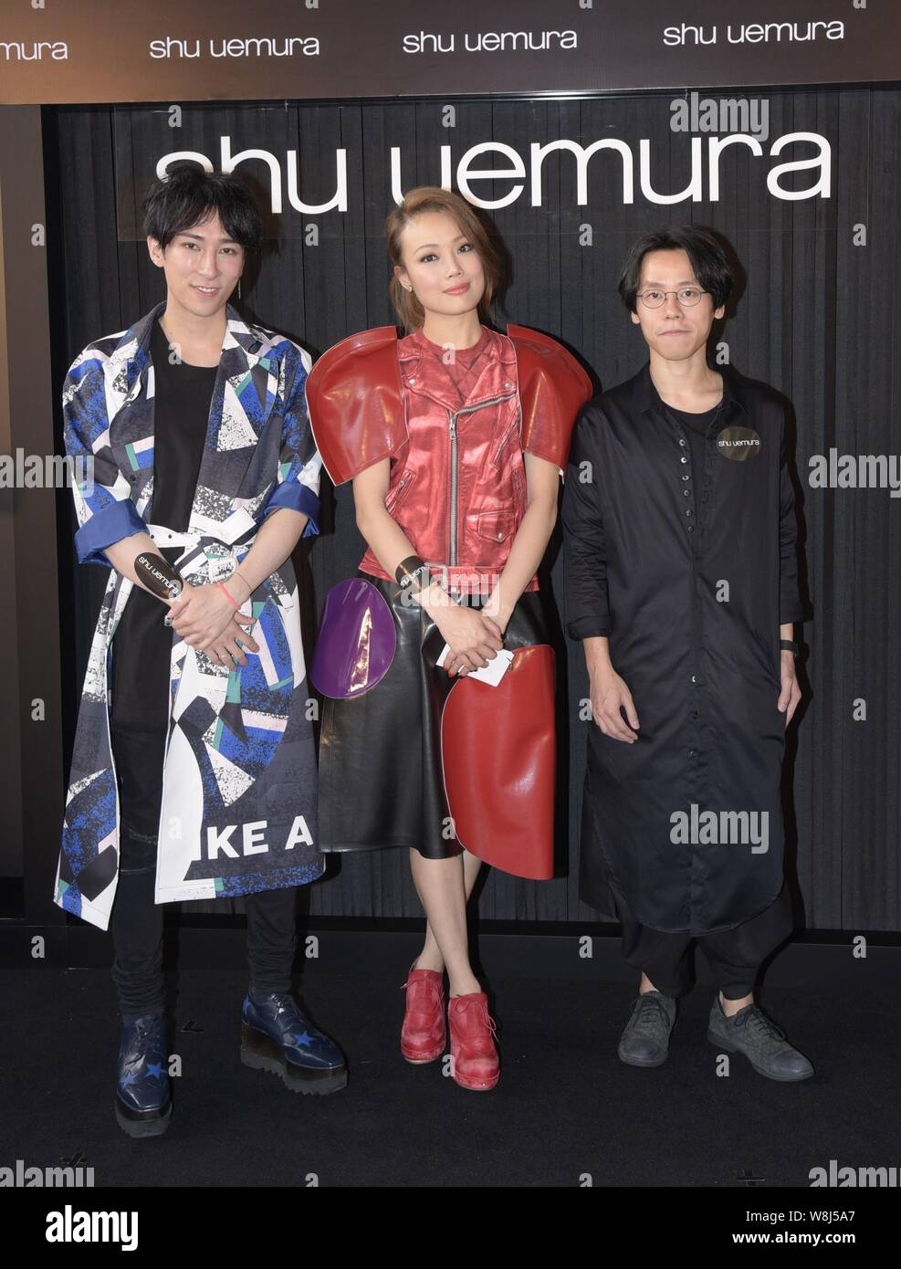 Hong Kong singer Joey Yung, center, attends a promotional event for Shu Uemura cosmetics in Hong Kong, China, 16 March 2015. Stock Photo