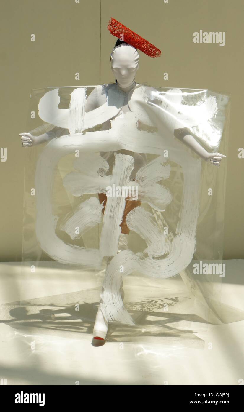 A model displays a creation of calligraphy during a fashion show at ...