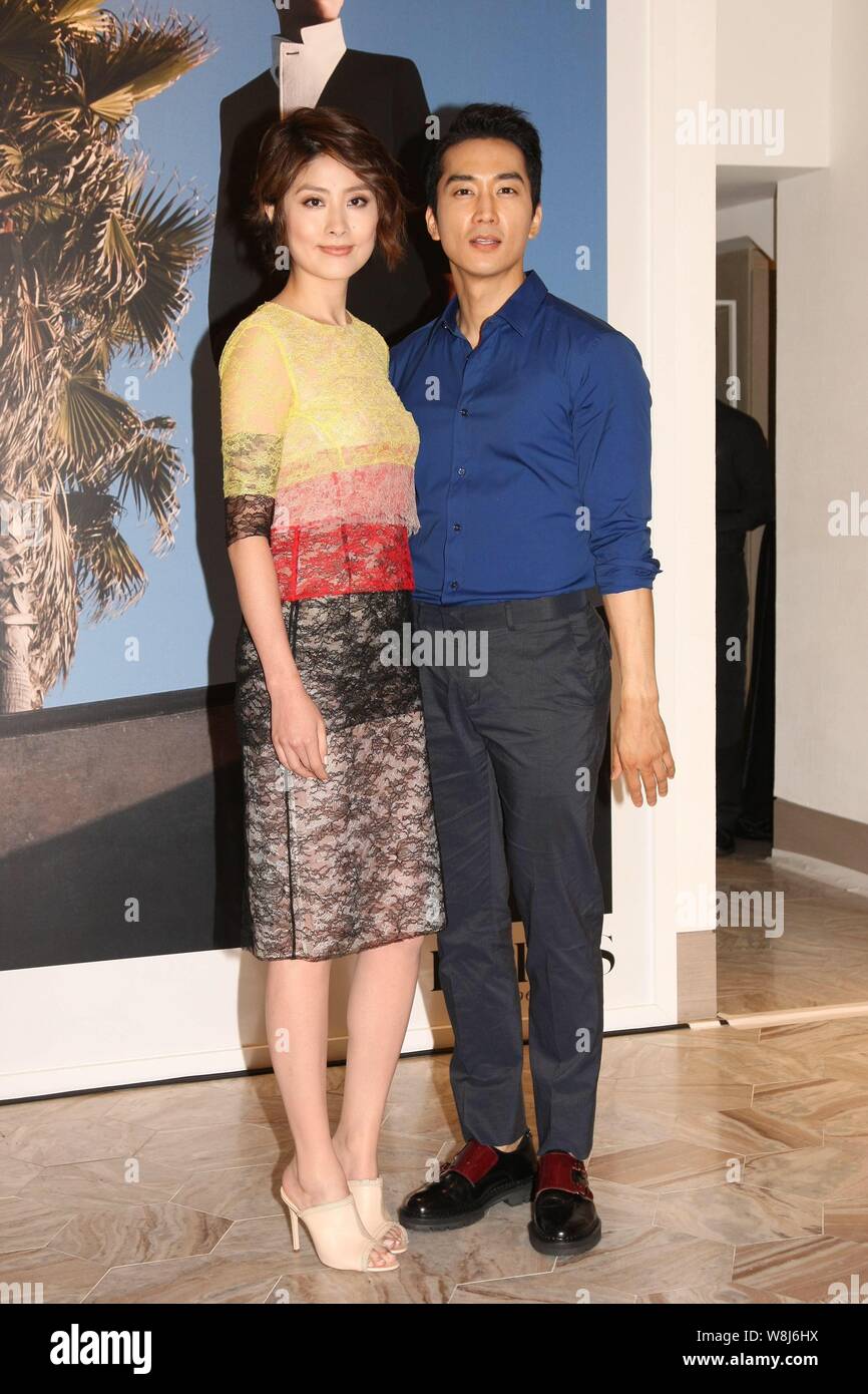 Hong Kong singer Kelly Chen, left, and South Korean actor Song Seung-heon  pose at the opening ceremony for Ports 1961's new store in Hong Kong, China  Stock Photo - Alamy