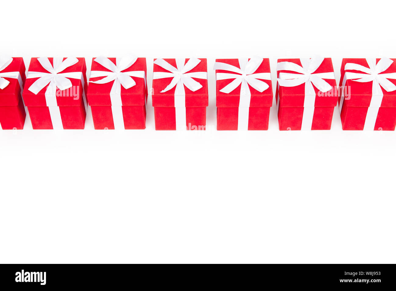 Christmas red gift boxes stay in line with copy space. Isolated on ...