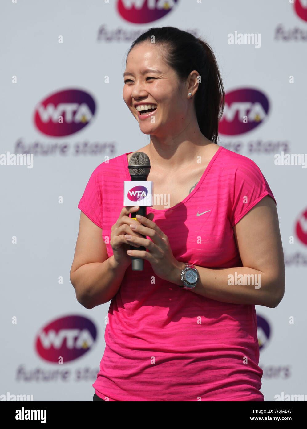 Retired Chinese tennis star Li Na reacts in a master class during the