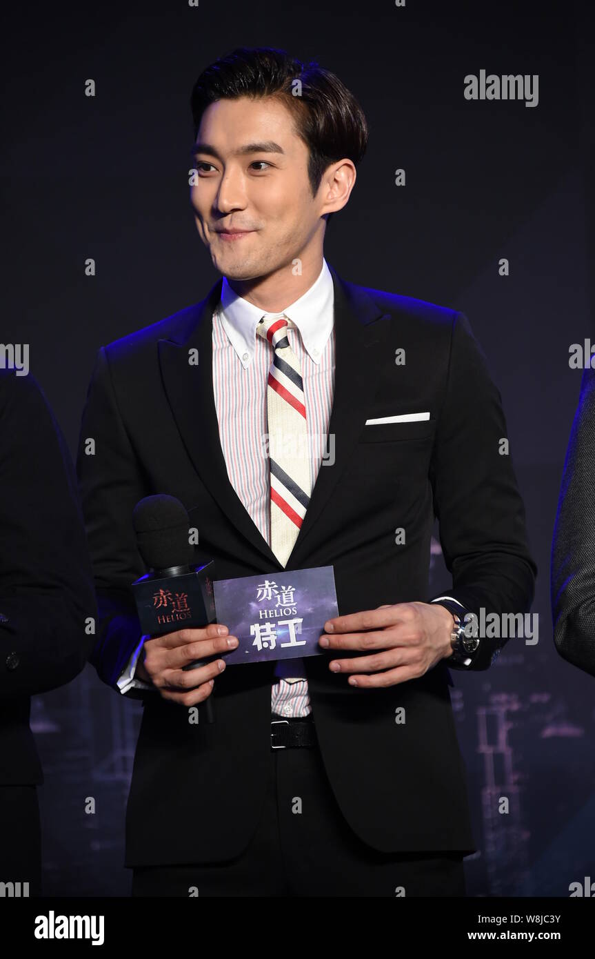 South Korean actor Choi Siwon smiles during a press conference for his new movie 'Helios' in Beijing, China, 9 March 2015. Stock Photo