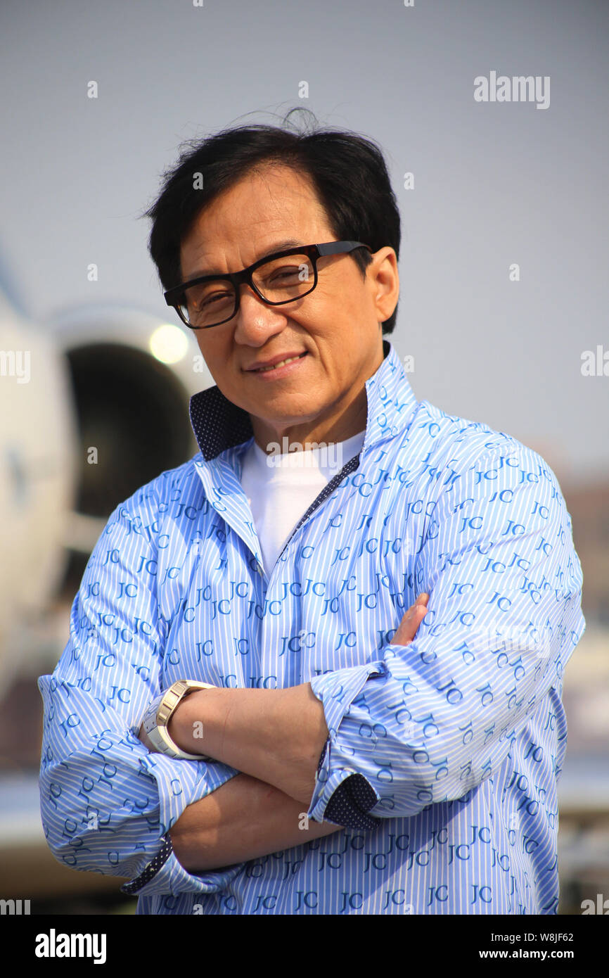 Hong Kong kungfu star Jackie Chan poses in front of a Legacy 500 plane of  Embraer before the 2015 Asian Business Aviation Conference and Exhibition  (A Stock Photo - Alamy
