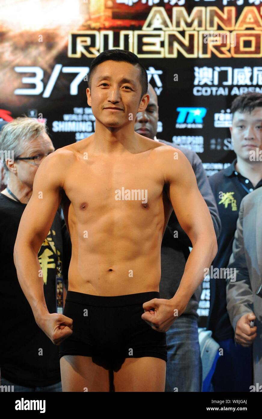 Olympic boxing gold medalist Zou Shiming of China, front, poses during