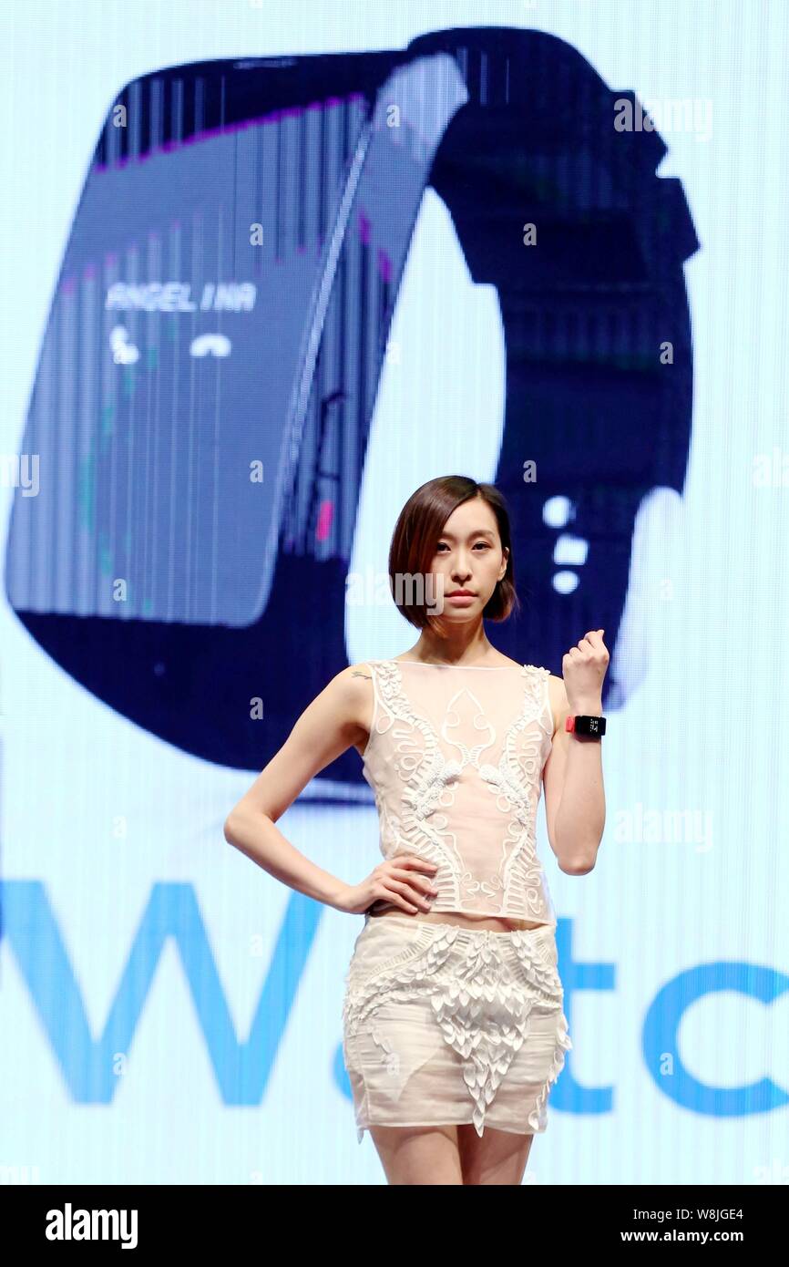 A model displays a smartwatch during the GSMA Mobile World Congress 2015 in Shanghai, China, 15 July 2015. Stock Photo