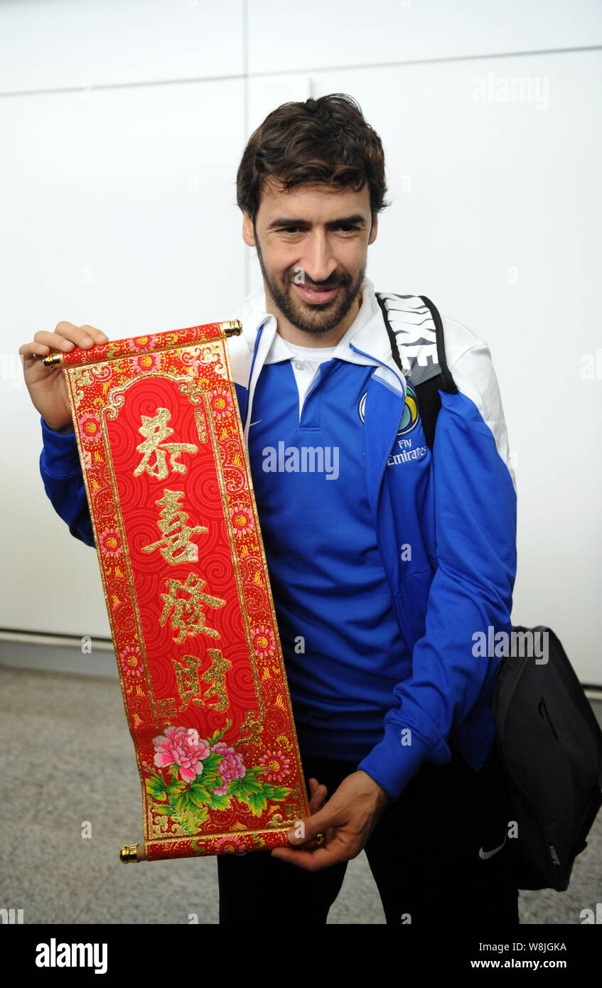 Spanish football star Raul Gonzalez Blanco of New York Cosmos poses with a Chinese festive scroll as he arrives at the Hong Kong International Airport Stock Photo