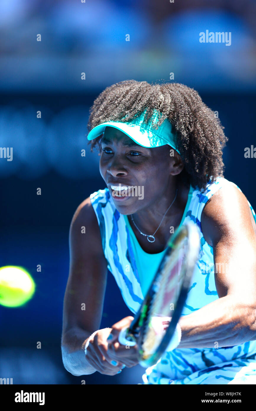 Venus Williams of the U.S. returns a shot to Camila Giorgi of Italy during their third round match at the Australian Open tennis tournament in Melbour Stock Photo