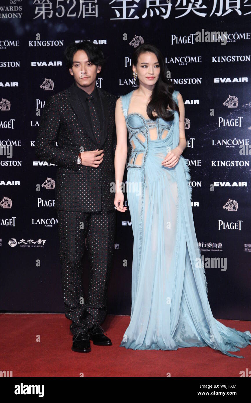 Taiwanese actress Shu Qi, right, clad in a dress from the Versace Fall/Winter  2015 Paris Haute Couture collection, and actor Chang Chen arrive on the  Stock Photo - Alamy