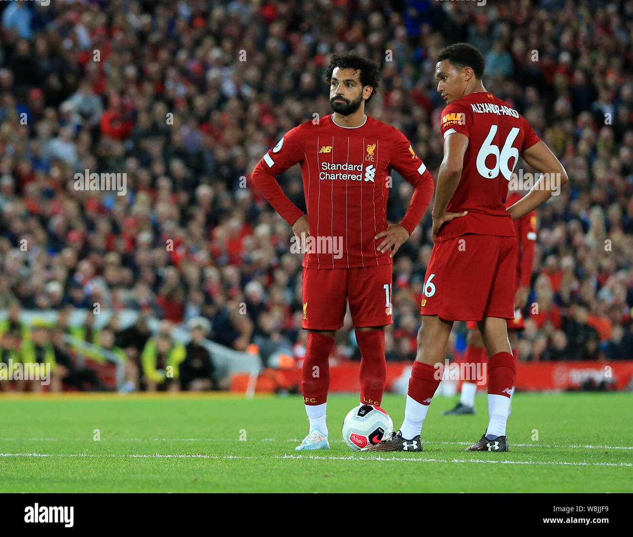 Anfield, Liverpool, UK. 9th Aug, 2019. Premier League Football, Liverpool  versus Norwich; Mohammed Salah and Trent Alexander-Arnold of Liverpool  prepare for a direct free kick on goal on the edge of the