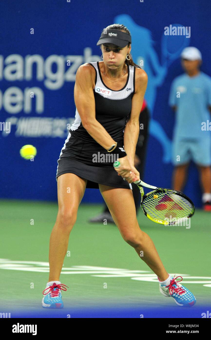 Martina Hingis of Switzerland returns a shot as she and Sania Mirza of India compete against Monica Niculescu of Romania and Anna-Lena Friedsam of Ger Stock Photo
