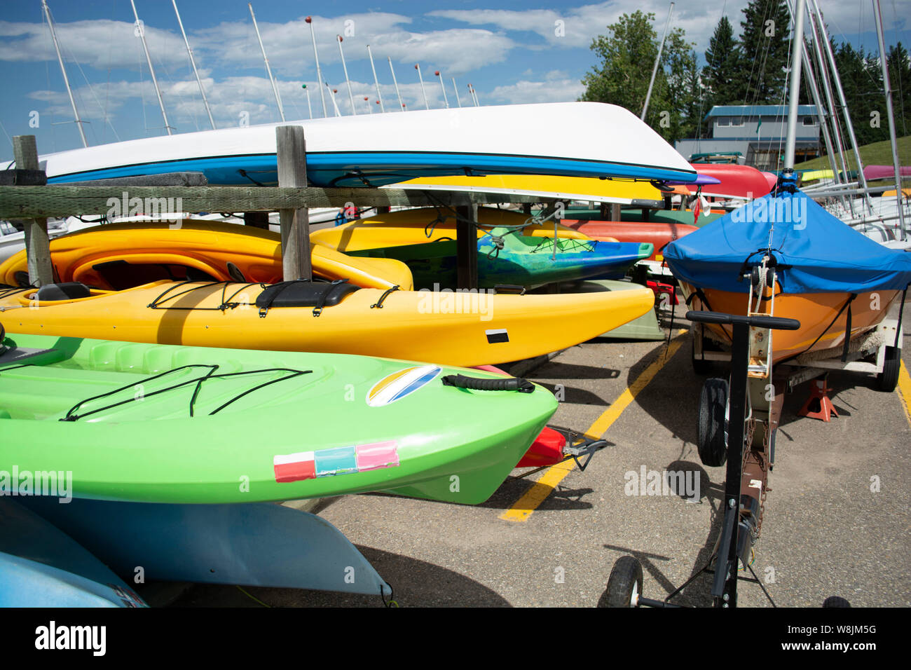 Boat yard with small sailing boats and kayaks Stock Photo Alamy