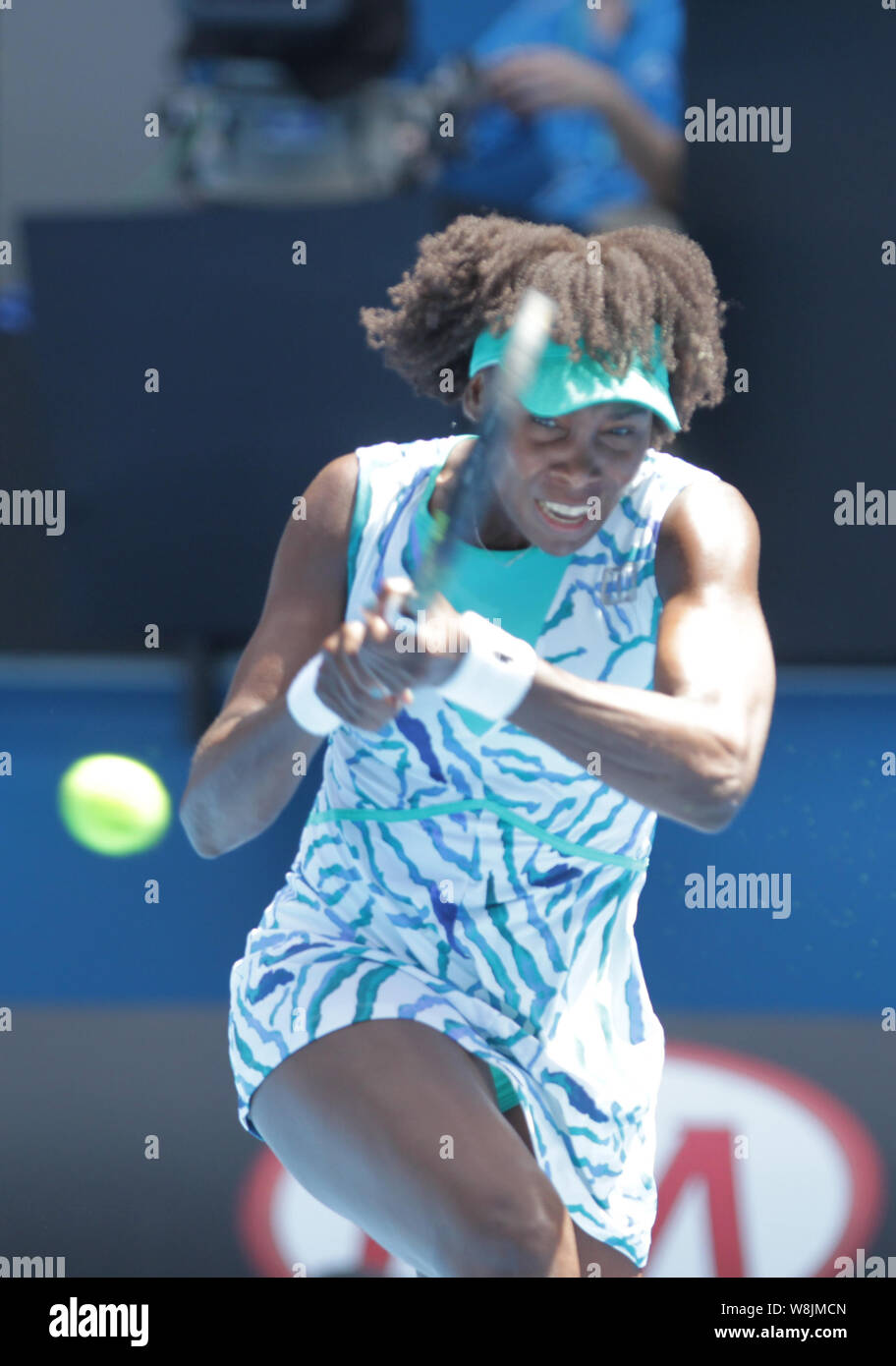 Venus Williams of the U.S. returns a shot to Camila Giorgi of Italy during their third round match at the Australian Open tennis tournament in Melbour Stock Photo