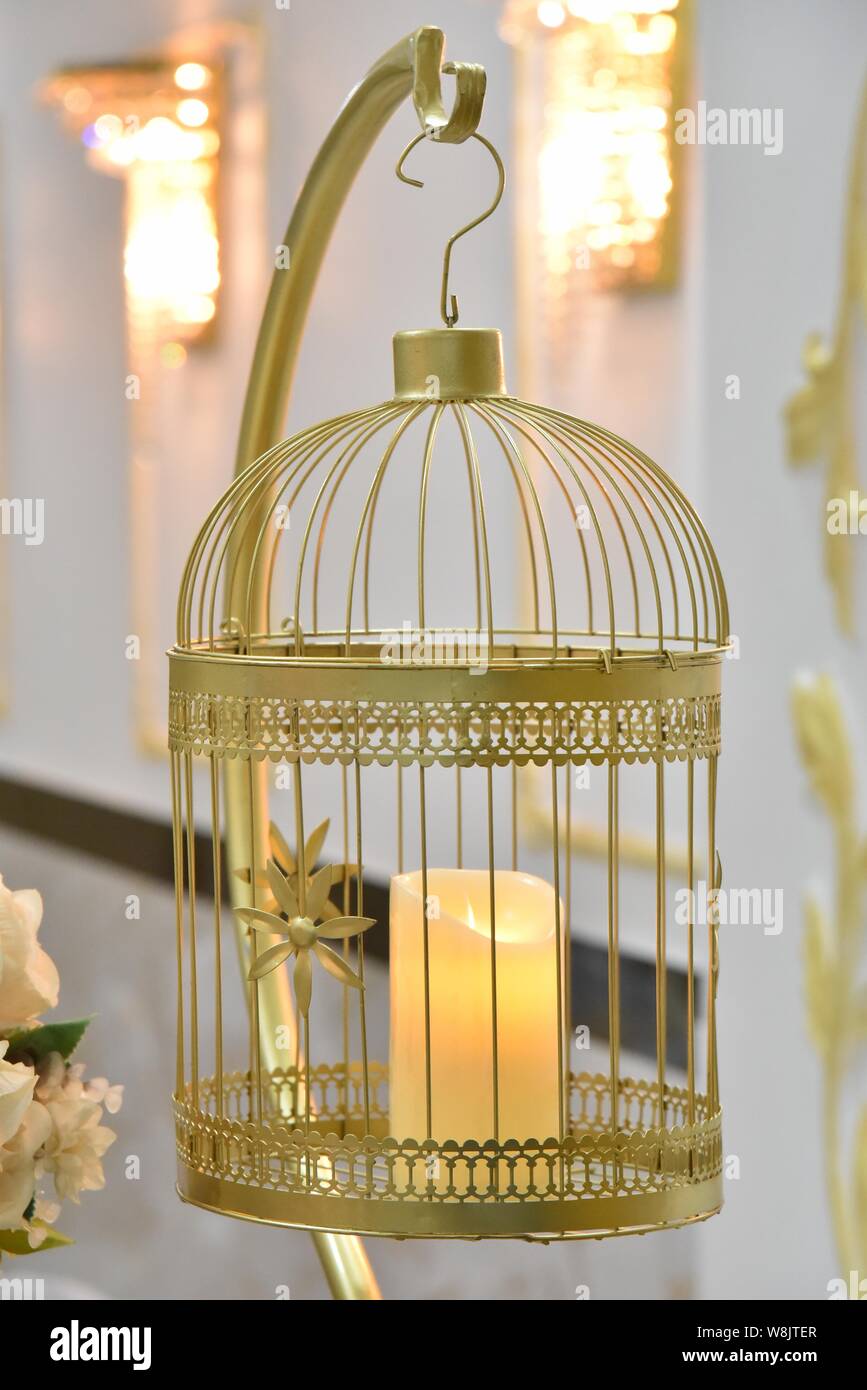 Decorative white bird cage. Vintage decorative candlestick hanging