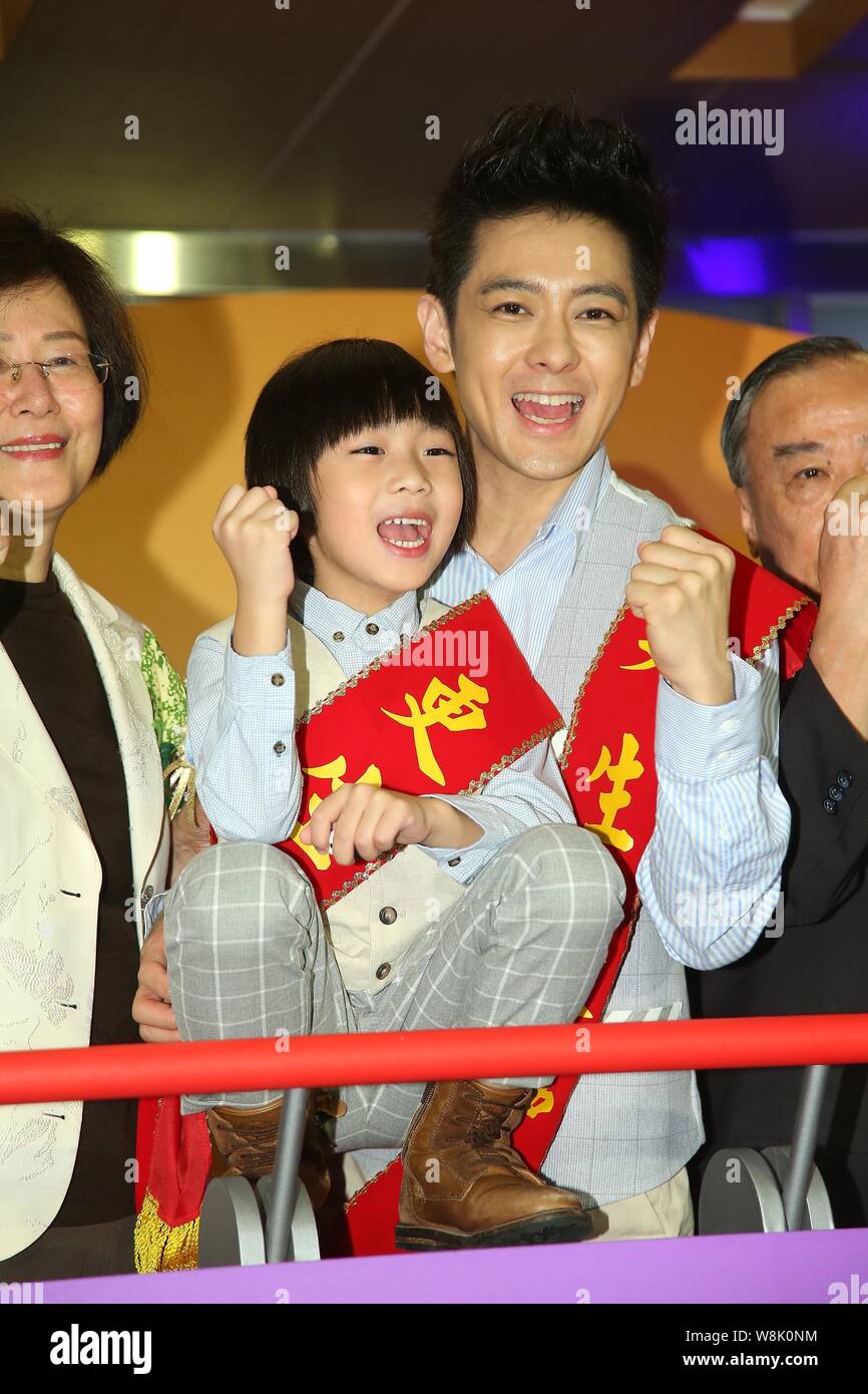 Taiwanese singer, actor and racer Jimmy Lin, center, and his son Kimi,  front, pose during a launch event for the 70th anniversary celebration of  Taiwa Stock Photo - Alamy
