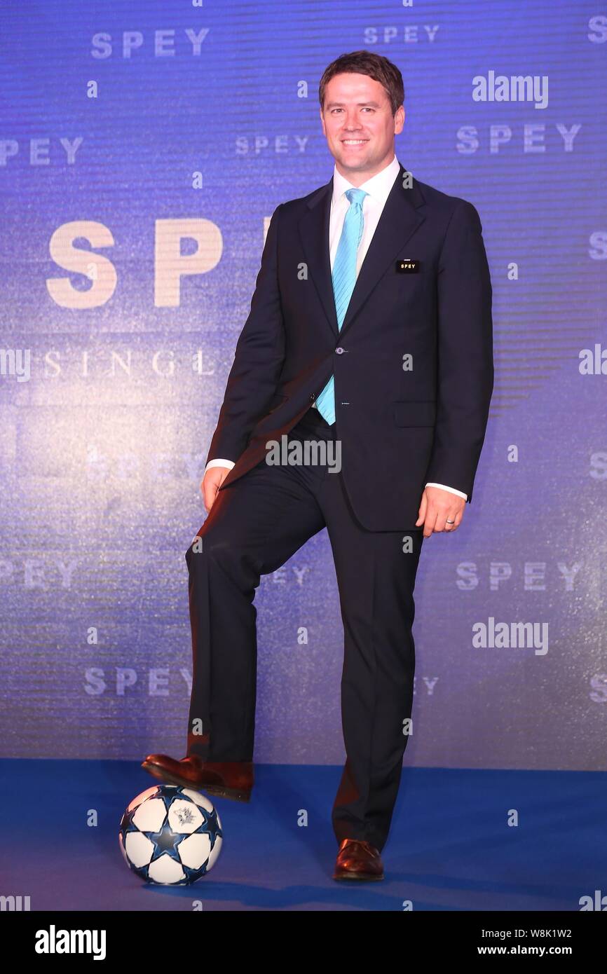 English football star Michael Owen poses during a press conference