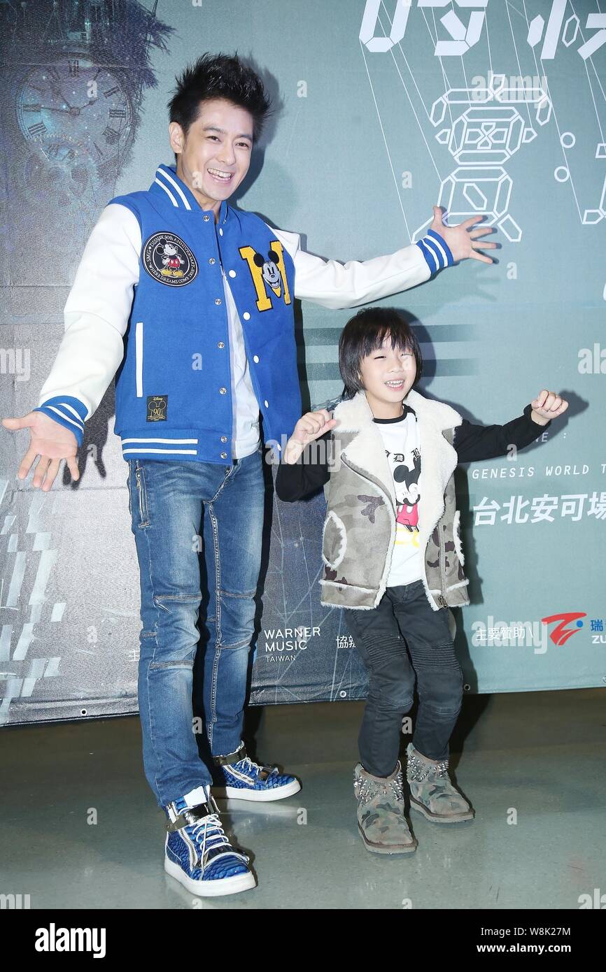 Taiwanese singer, actor and racer Jimmy Lin, left, and his son Kimi pose as  they arrive for the Taipei concert of Singaporean singer JJ Lin\