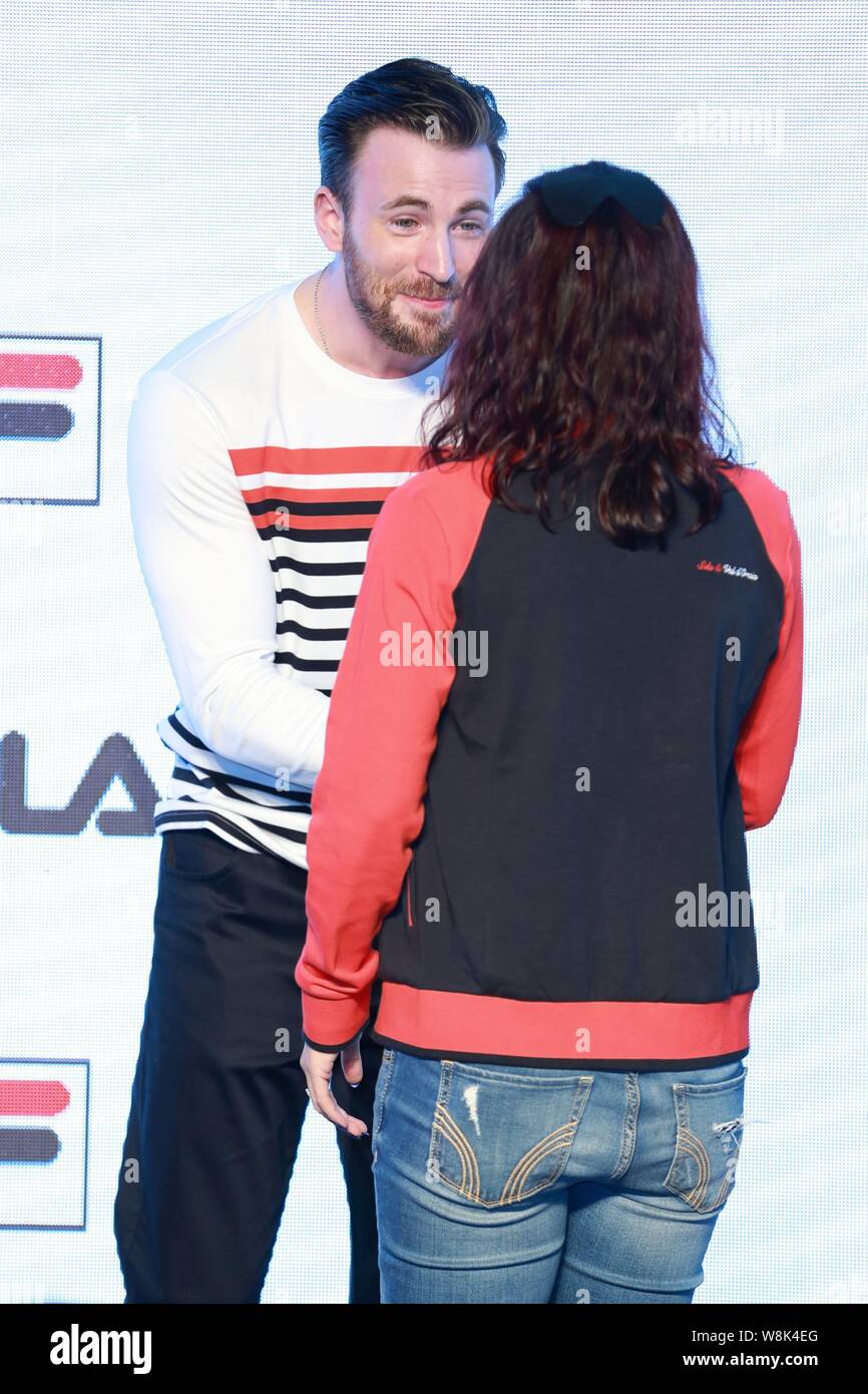 American actor Chris Evans, left, shakes hands with a fan at a promotional  event for FILA sportswear in Shanghai, China, 17 September 2015 Stock Photo  - Alamy