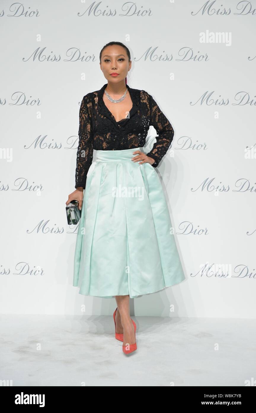 Chinese jewellery designer Wan Baobao, granddaughter of former Chinese Vice Premier Wan Li, poses as she arrives for an opening event for the Miss Dio Stock Photo