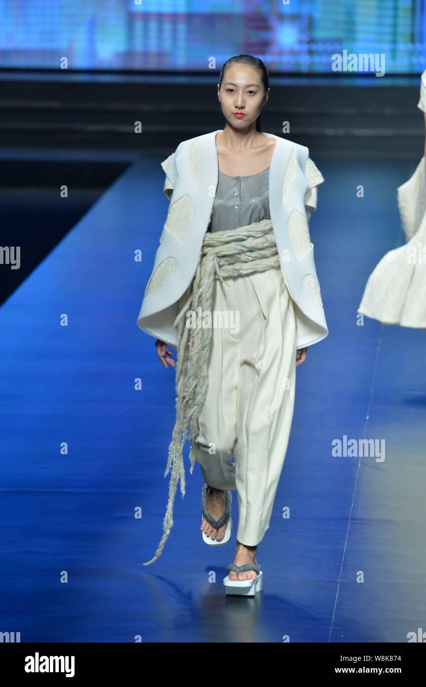 A model displays a new creation at Hempel Award - The 23rd China ...