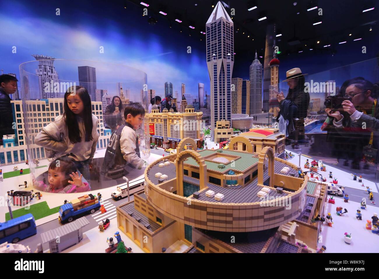 Visitors look at Shanghai s landmark buildings made with Lego bricks at the Shanghai Legoland Discovery Center in Shanghai China 7 April 2016. Vis Stock Photo Alamy