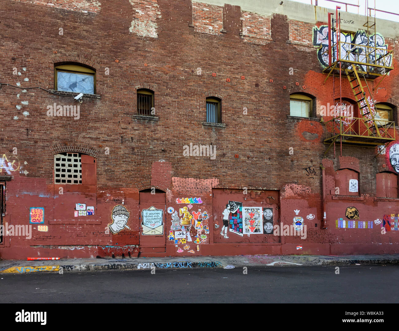 Dilapidated red brick exterior of old industrial building in the Arts