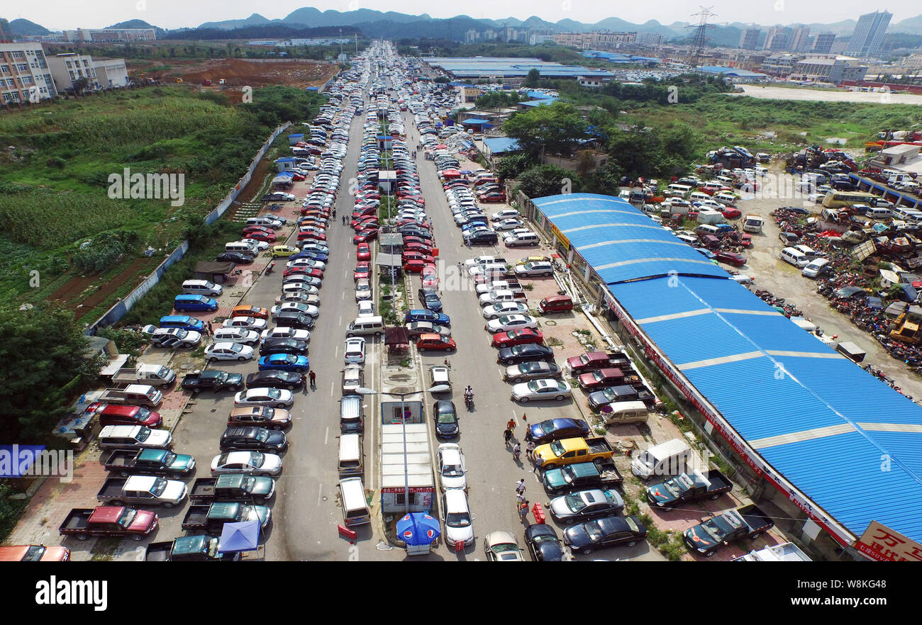 --FILE--Second-hand cars are lined up for sale at a used car market in Guiyang city, southwest China's Guizhou province, 9 August 2015.  China aims to Stock Photo