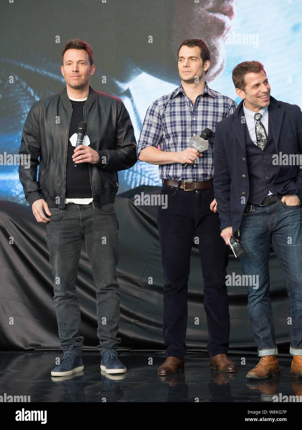 (From left) American actor Ben Affleck, British actor Henry Cavill and American director Zack Snyder attend a premiere for their new movie 'Batman v S Stock Photo