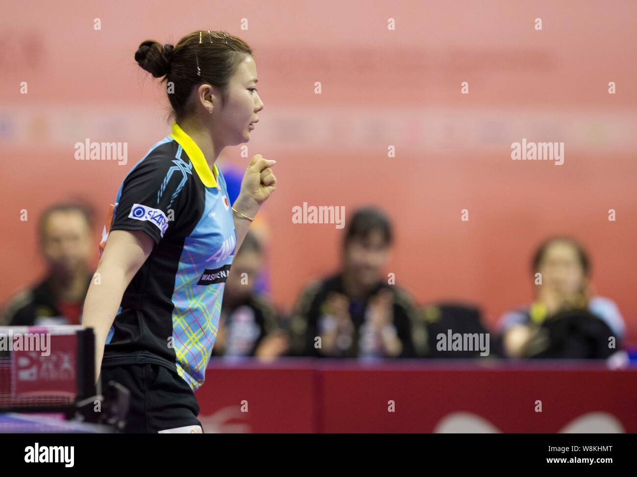 Fukuhara Ai of Japan reacts after scoring against Ri Mi Gyong of North Korea during their group match at the 2016 World Team Table Tennis Championship Stock Photo