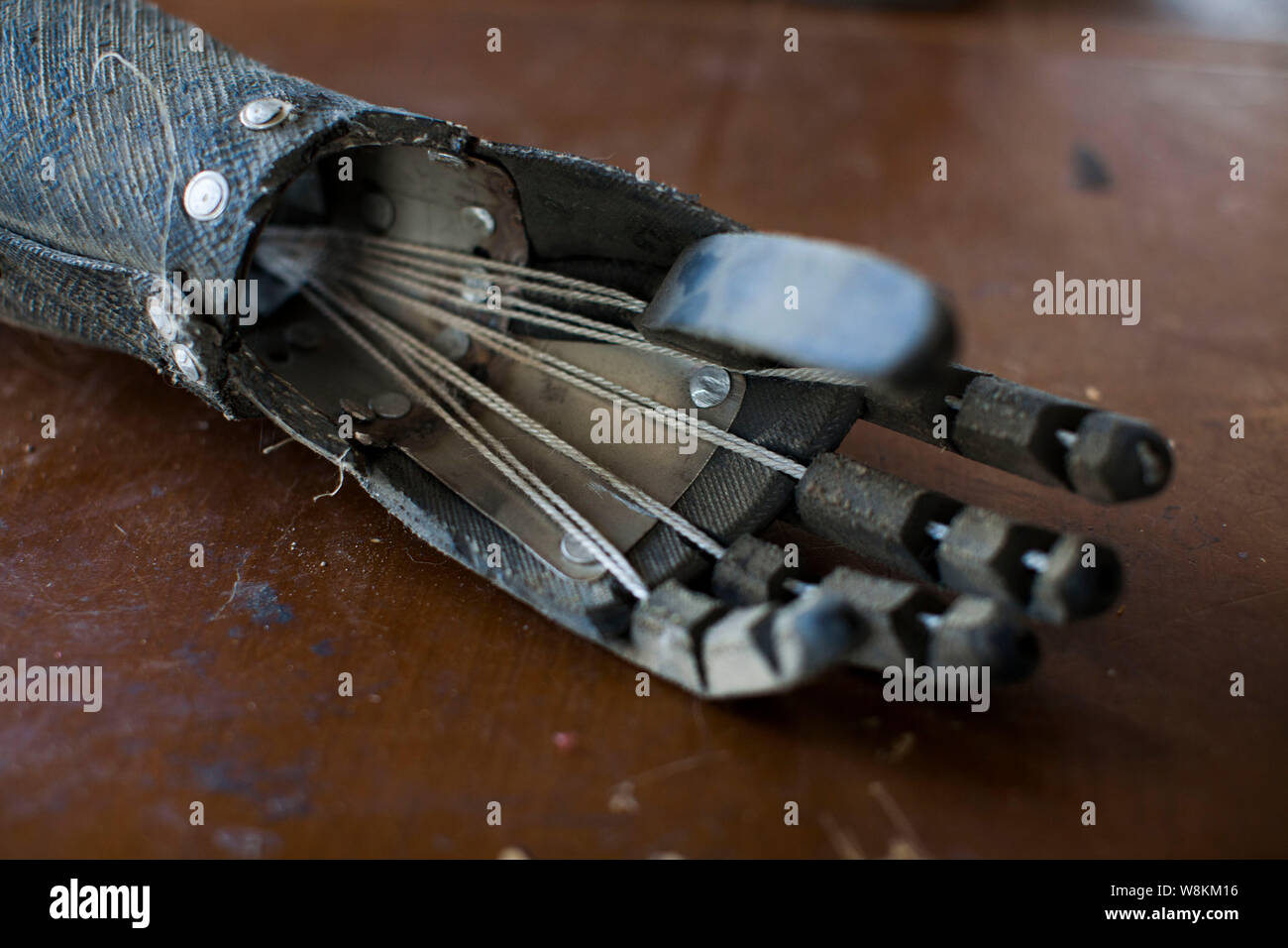 A homemade mechanical hand of the first generation made by armless farmer Sun Jifa is pictured at his home in Guanma village, Kouqian town, Yongji cou Stock Photo