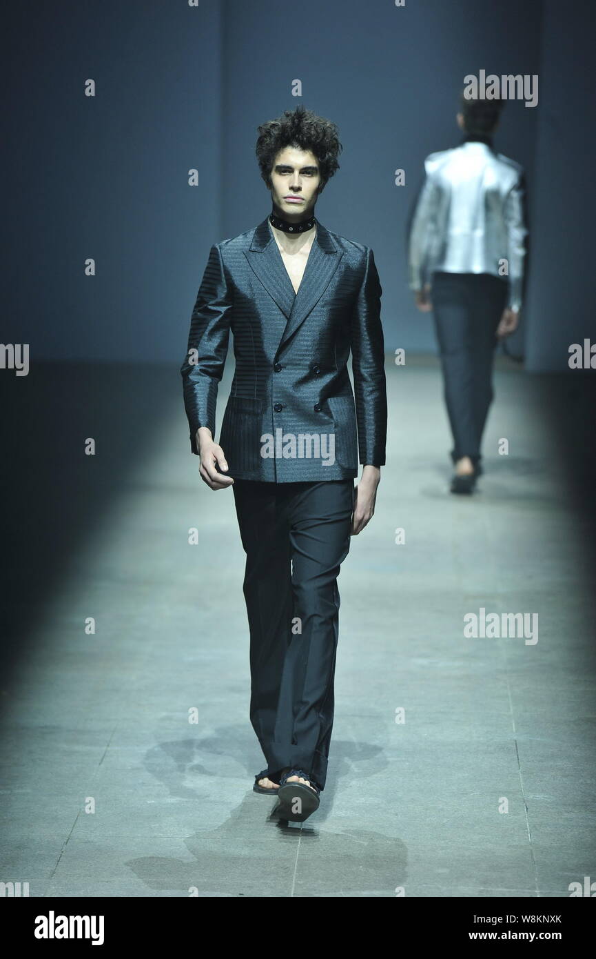 A model displays a new creation during a fashion show of the Alexander ...