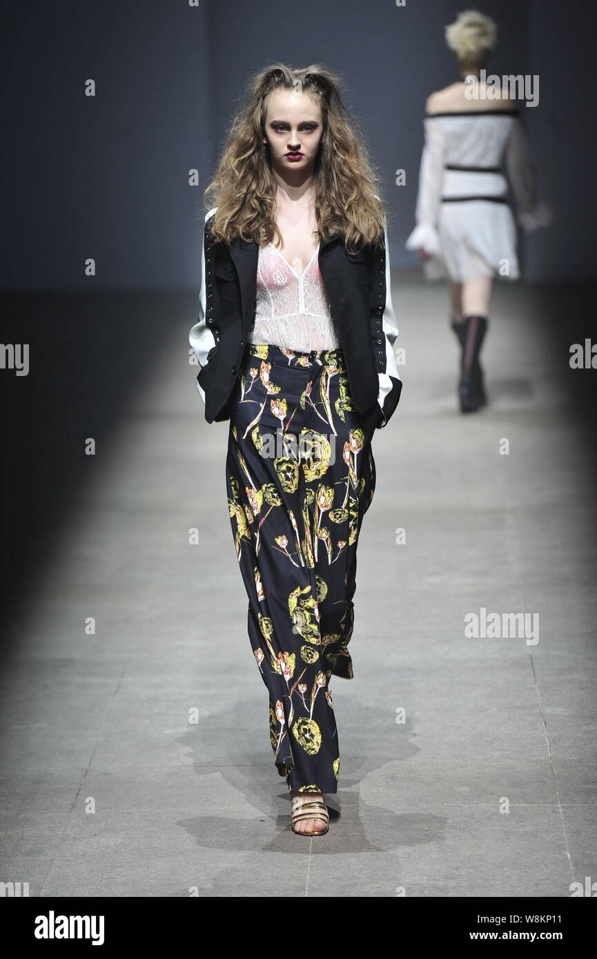 A model displays a new creation during a fashion show of the Alexander ...