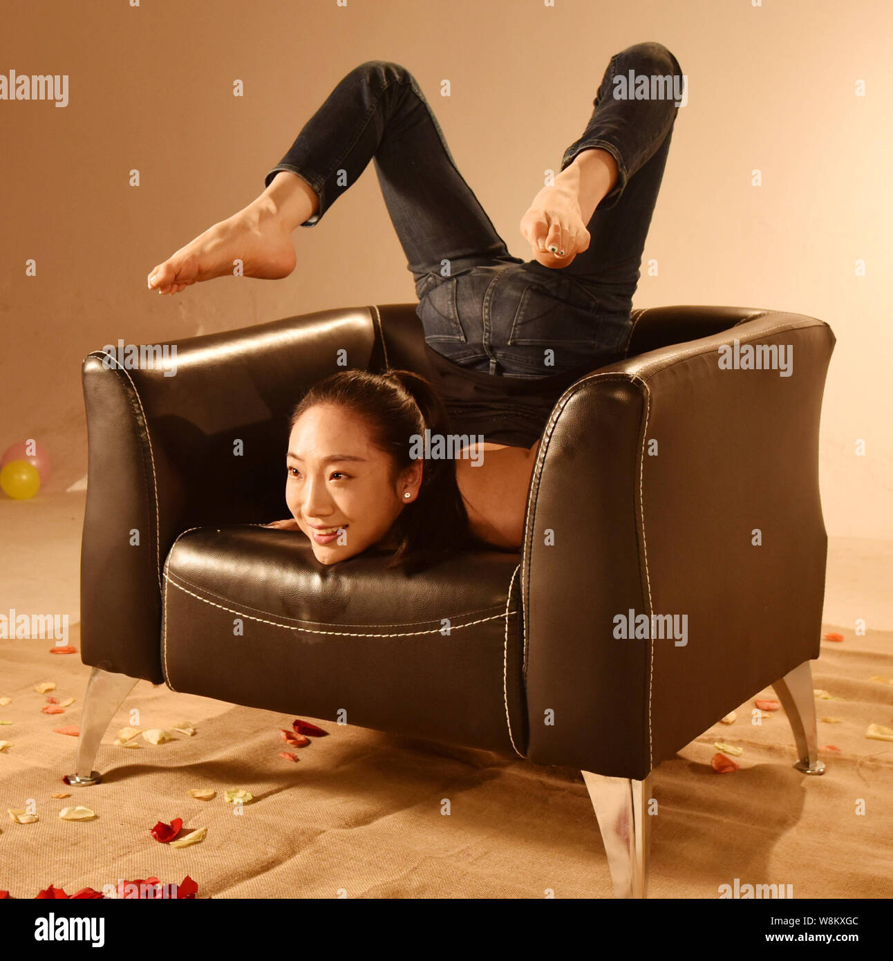 China's most flexible woman Liu Teng poses on a sofa during the filming  session for a video to promote Chinese jiujitsu in Beijing, China, 27  February Stock Photo - Alamy