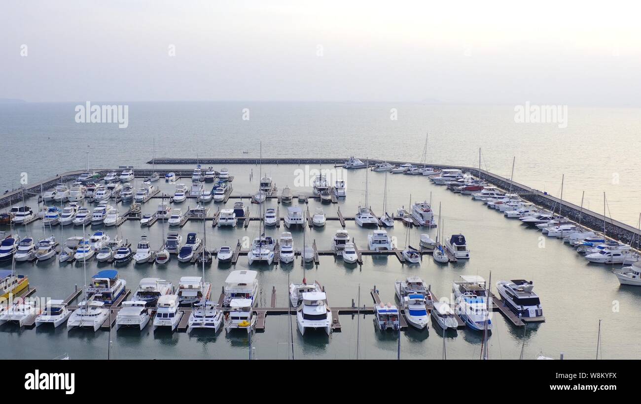 Aerial View by Drone of Yacht Club and Marina. Top view of yacht club.  White boats in sea water. Marina dock yachts and small moto. Yacht and  sailboat Stock Photo - Alamy