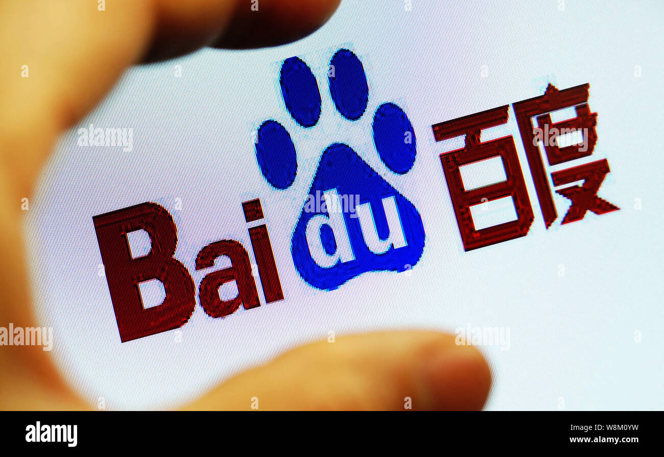 --FILE--A Chinese netizen looks at a logo of Baidu on his computer in ...