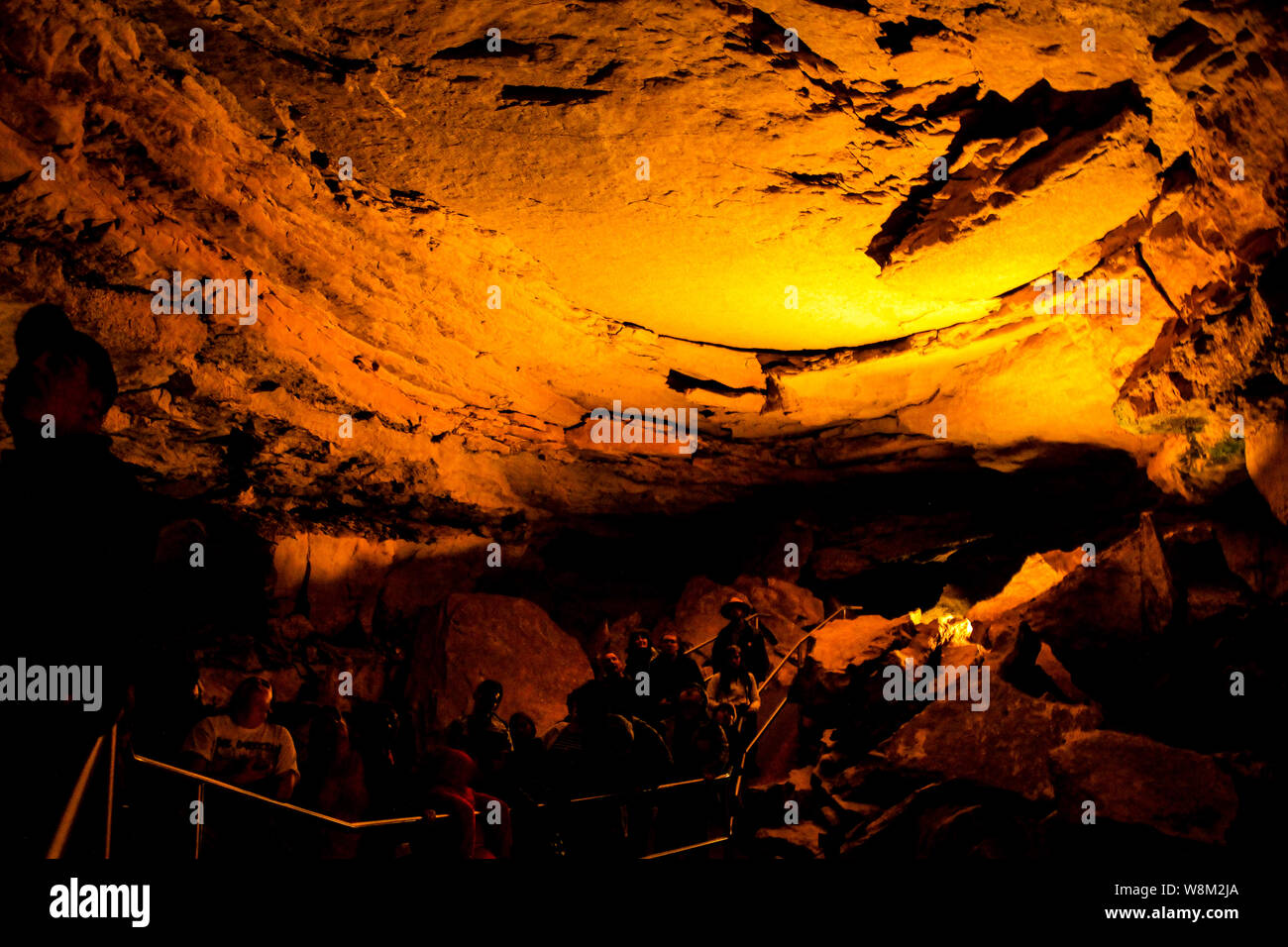 Tourists enjoying cave tour inside Mammoth Caves National Park Stock Photo